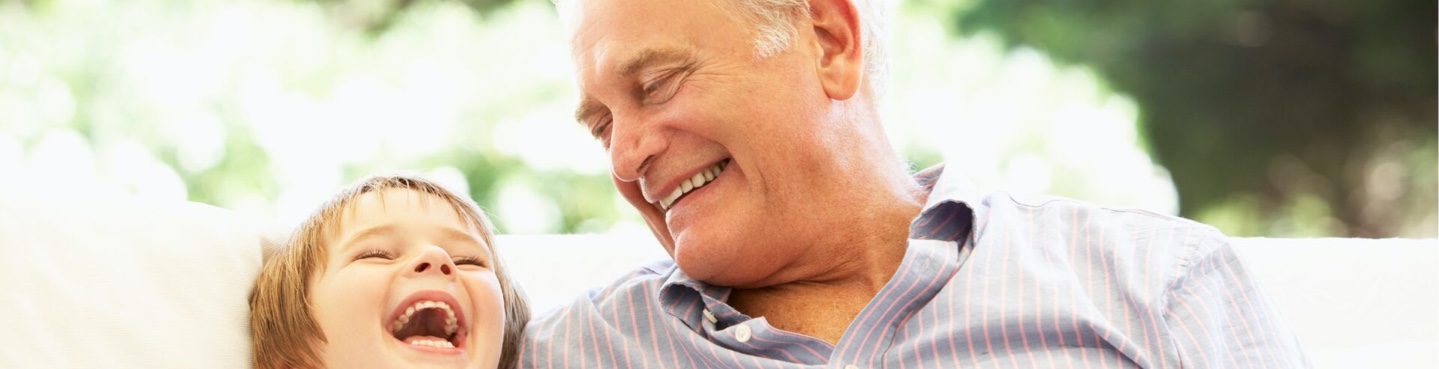 grandfather and grandson laughing together